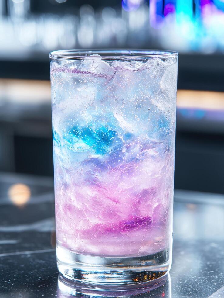 Colorful cocktail drink with ice cubes photo
