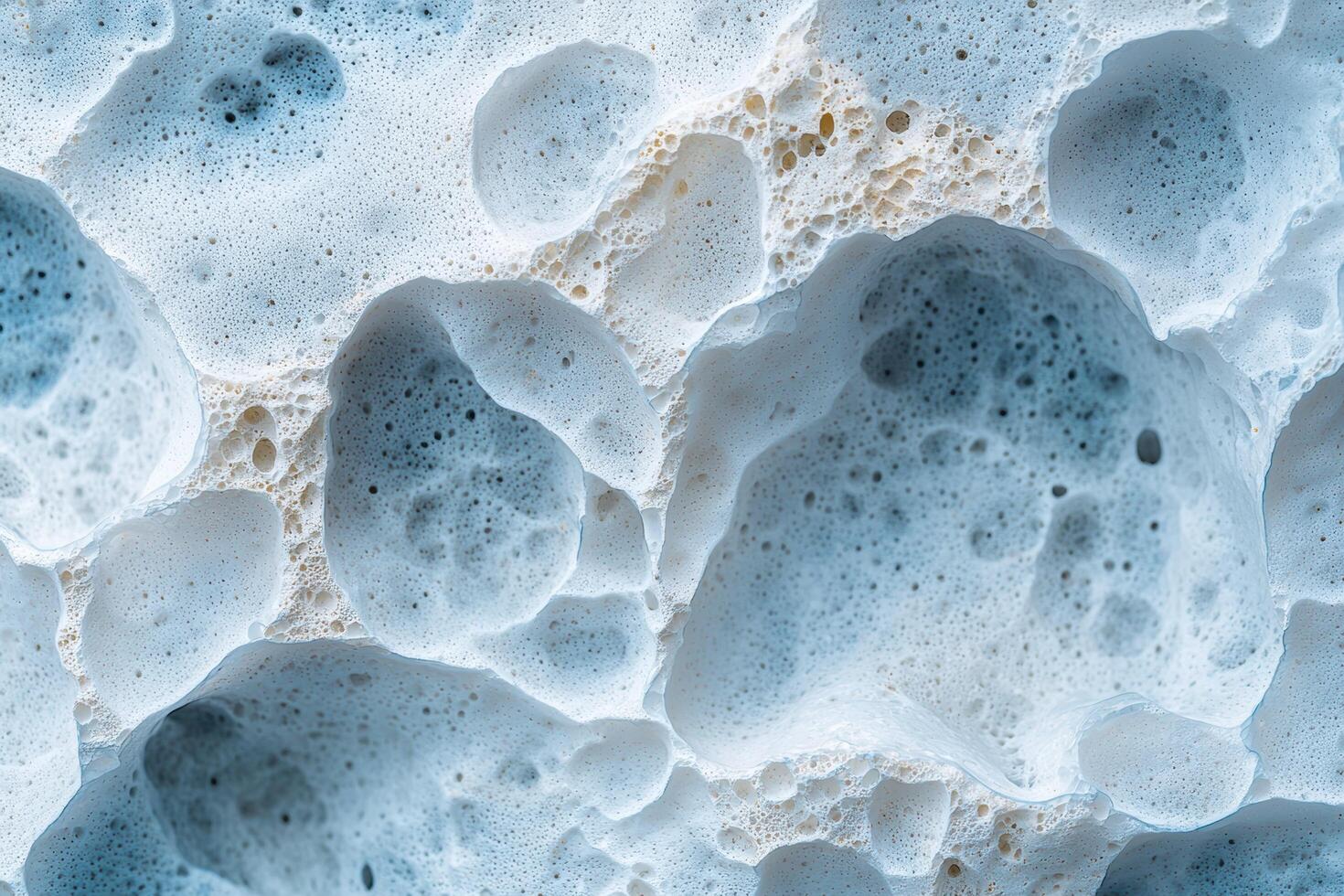 Closeup of abstract blue and white foam bubbles photo