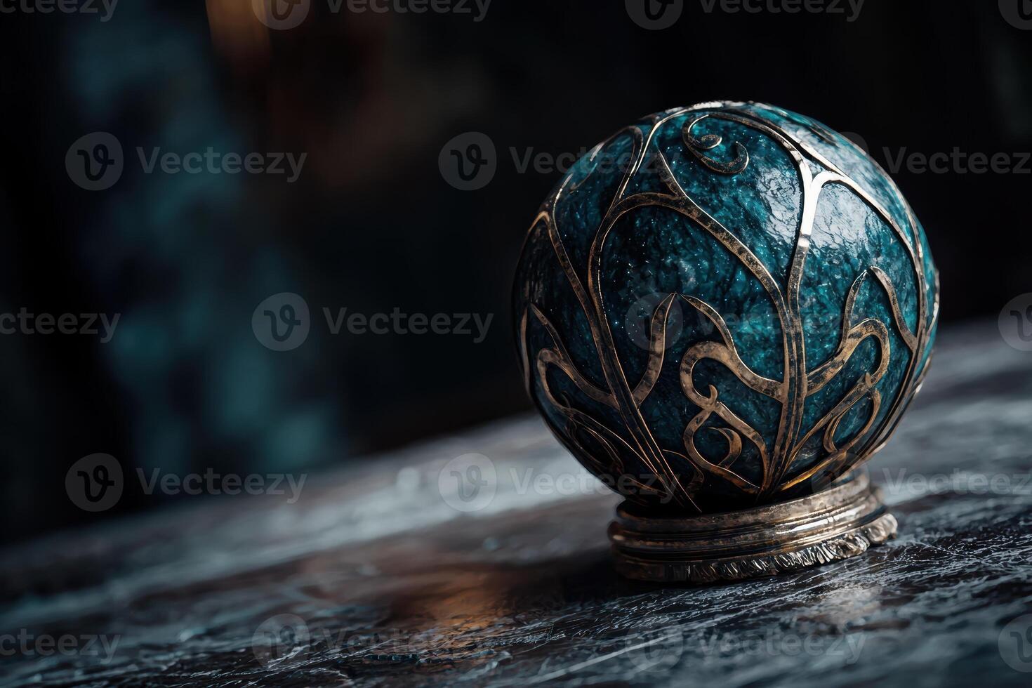 Intricate ornamental glass sphere on dark background photo