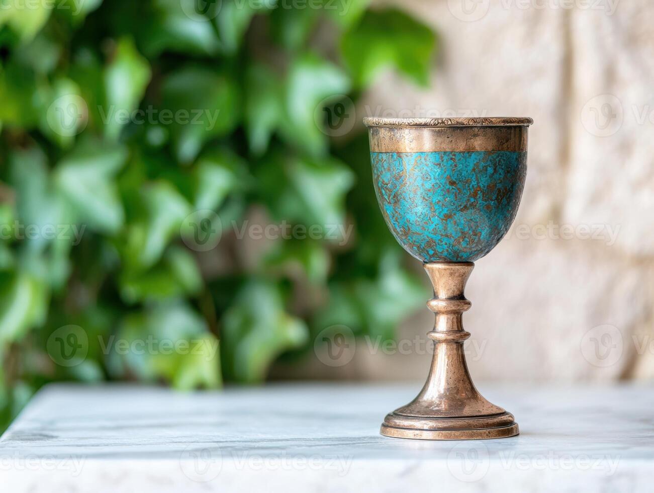 Ornate antique chalice with turquoise patina photo
