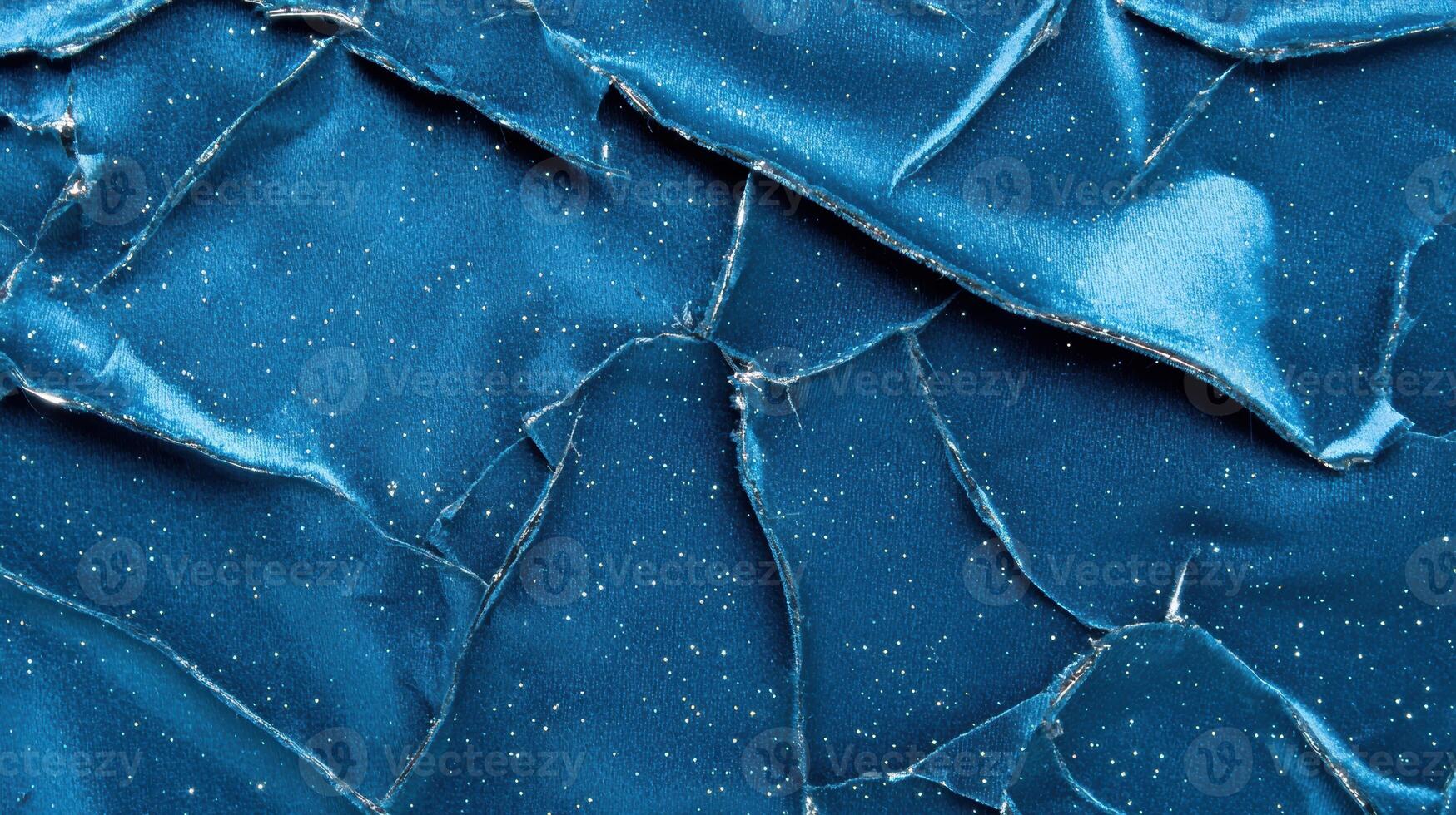 Shattered blue glass texture with sparkling glitter photo