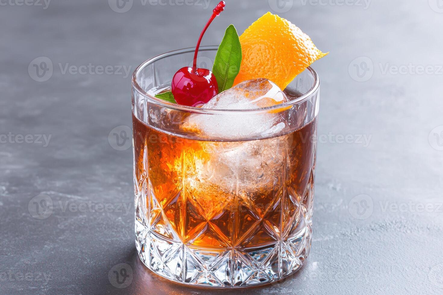 Refreshing old fashioned cocktail with orange slice and cherry photo
