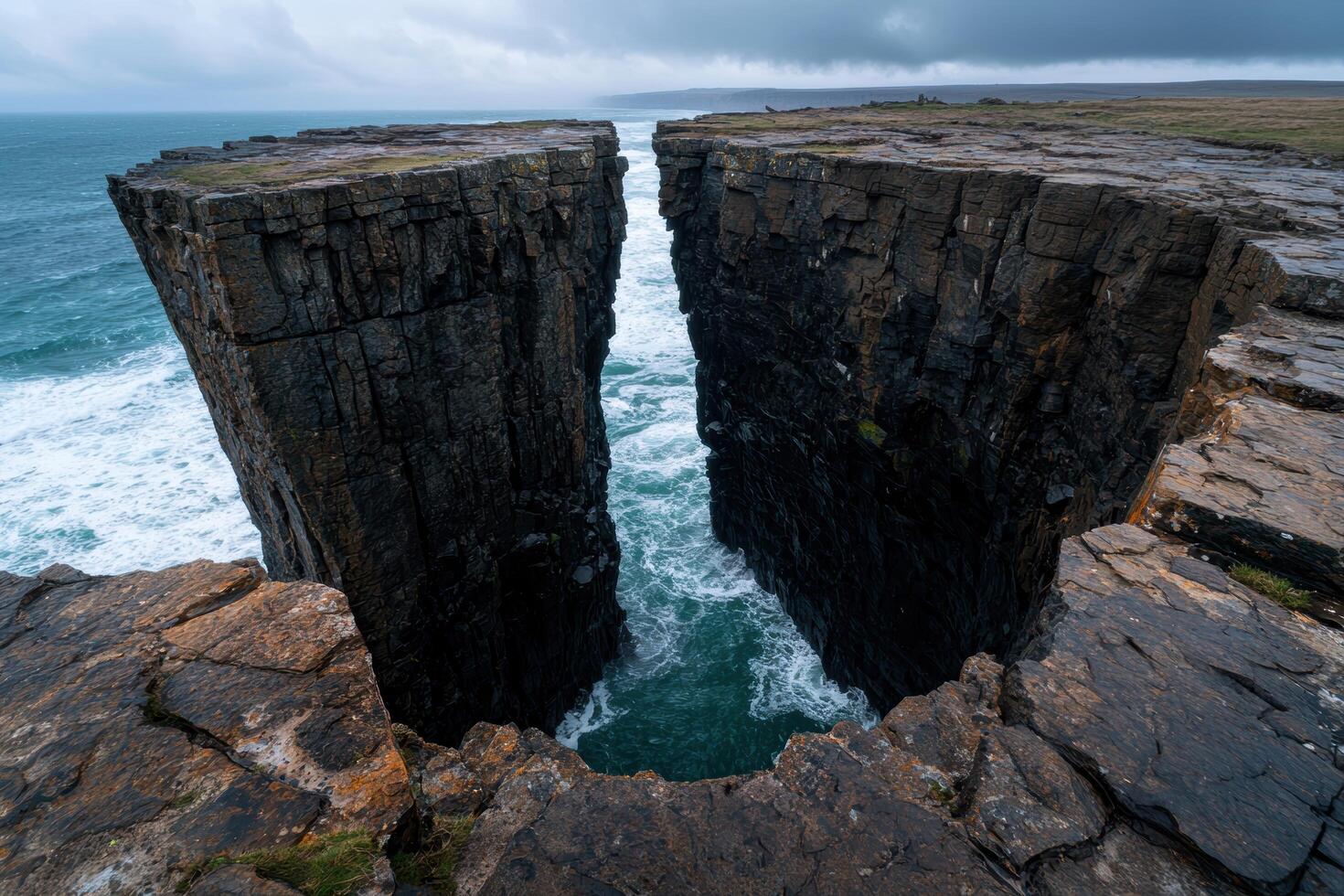 Dramatic rocky coastline with crashing waves photo