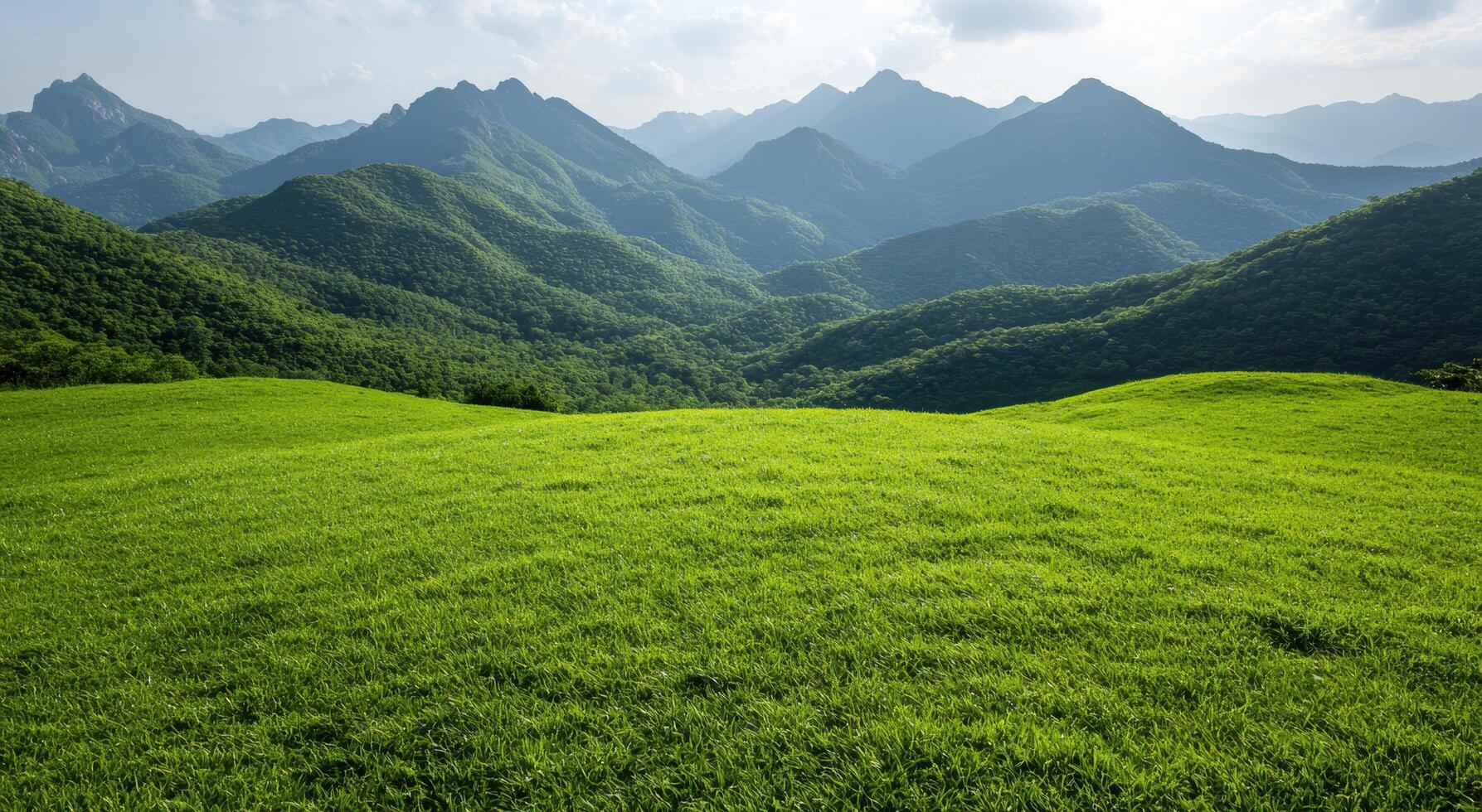 Lush green mountain landscape with rolling hills photo