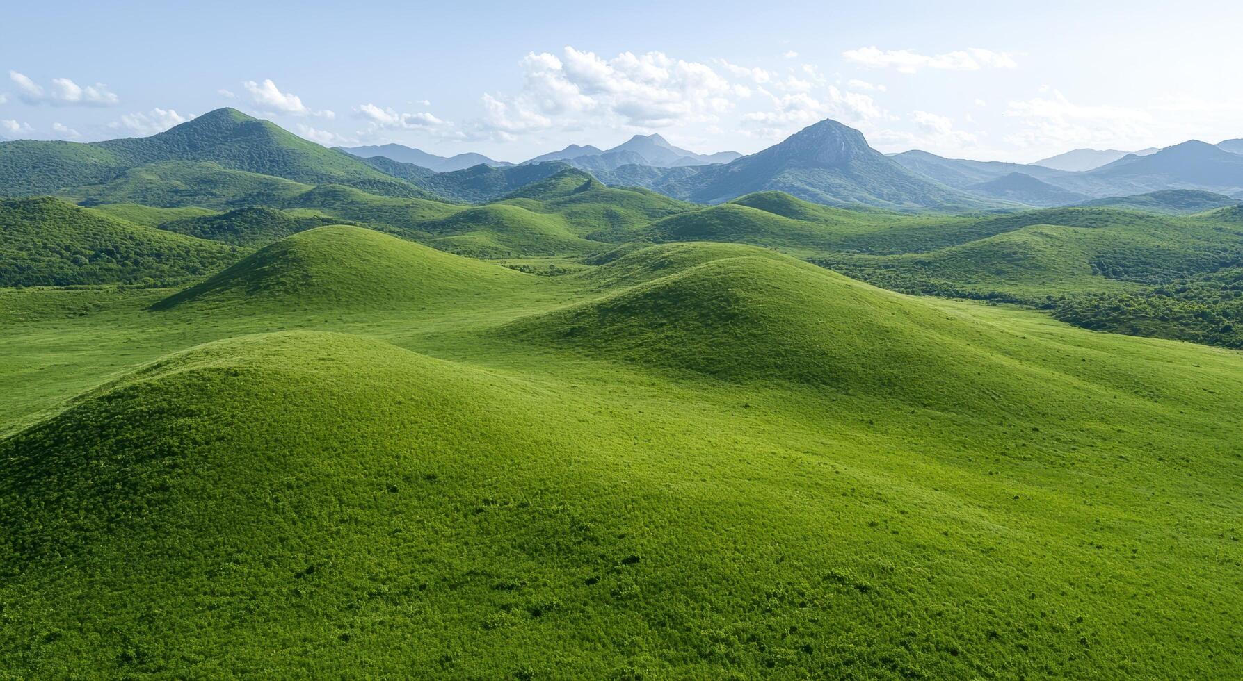 Lush green hills and mountains in a scenic landscape photo