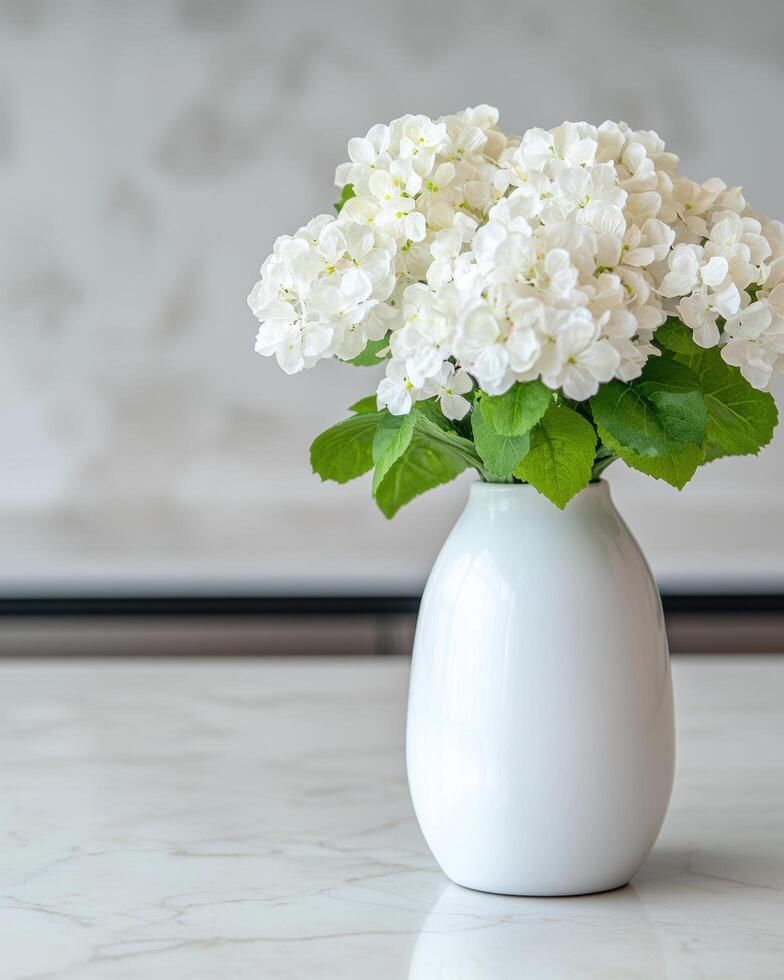 Elegant white hydrangea flowers in a vase photo