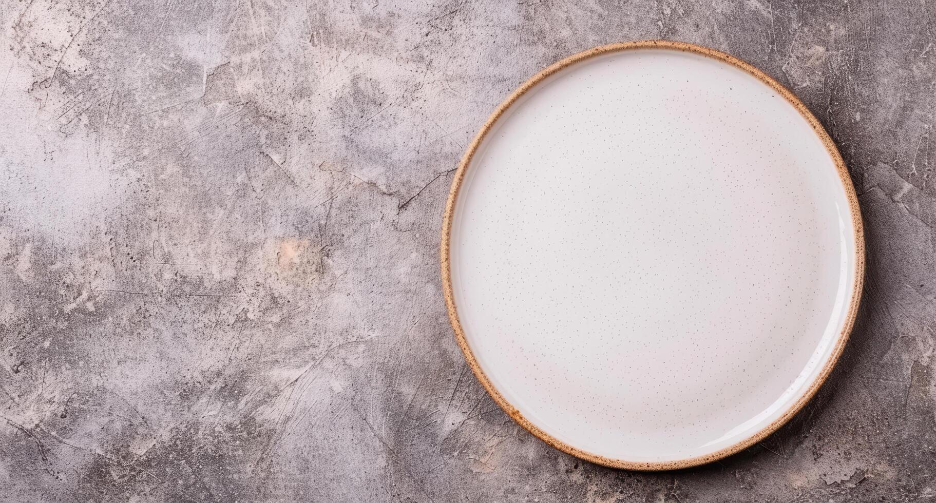 Empty ceramic plate on concrete background photo