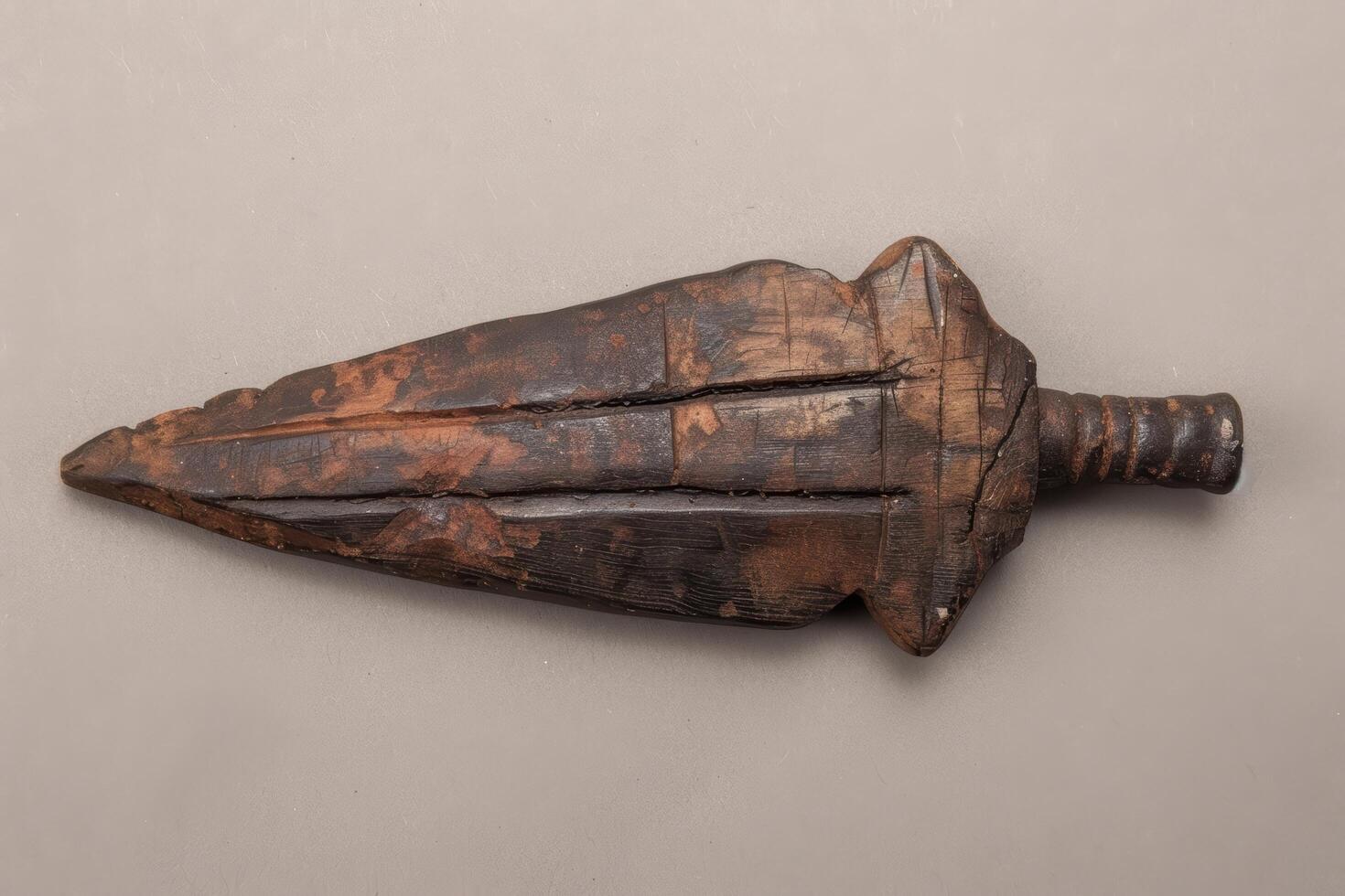 Antique wooden arrow shaped object photo