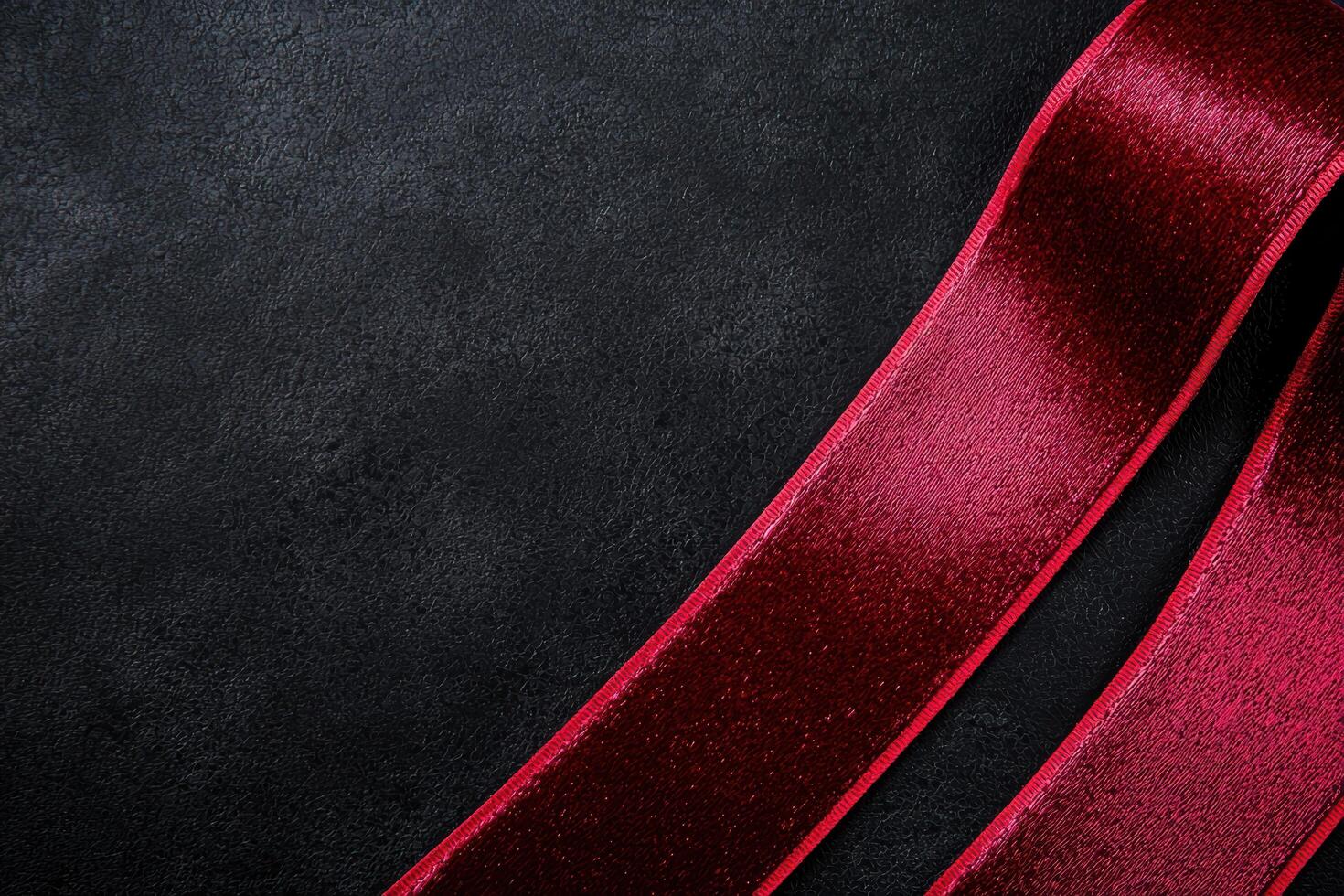 Vibrant red fabric against a dark background photo
