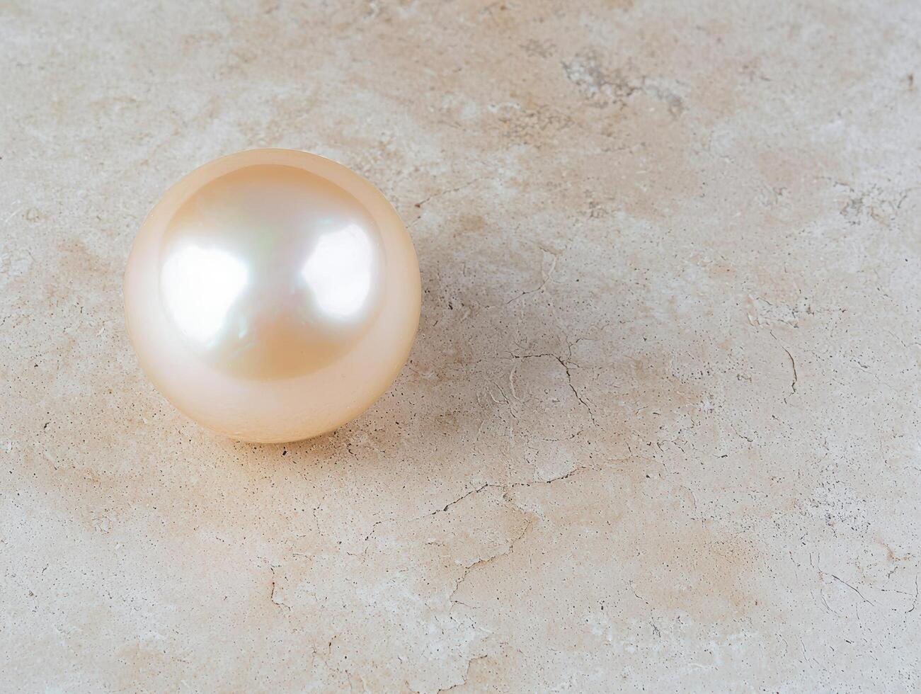 Elegant pearl on textured background photo