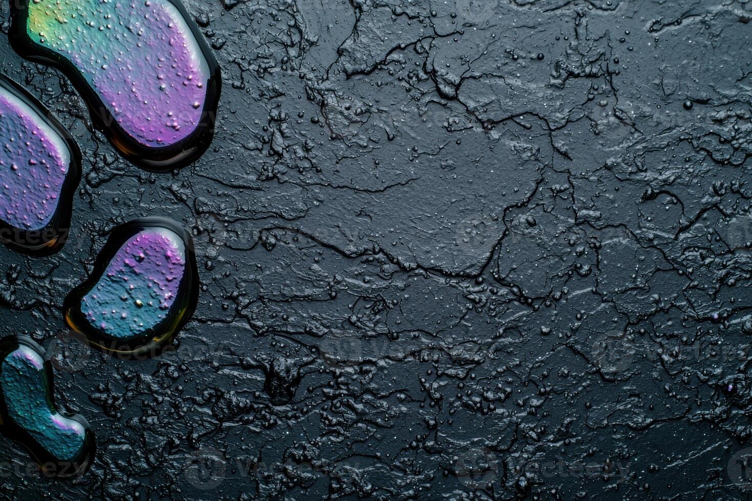 Colorful water droplets on dark surface photo