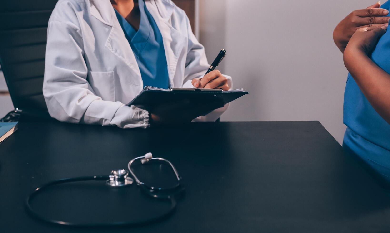 Clinic, tablet and hands of doctor with patient for consulting, medical service and help in hospital. Healthcare, telehealth and people on digital tech for diagnosis, online results and insurance photo