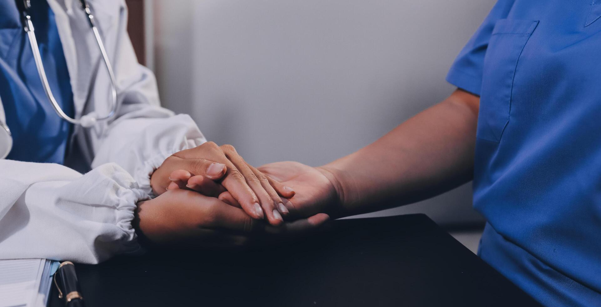 Kind male doctor wearing white coat consulting elder senior female patient holding hand of older woman giving help, safety, empathy and support, showing care and compassion concept. Close up view photo