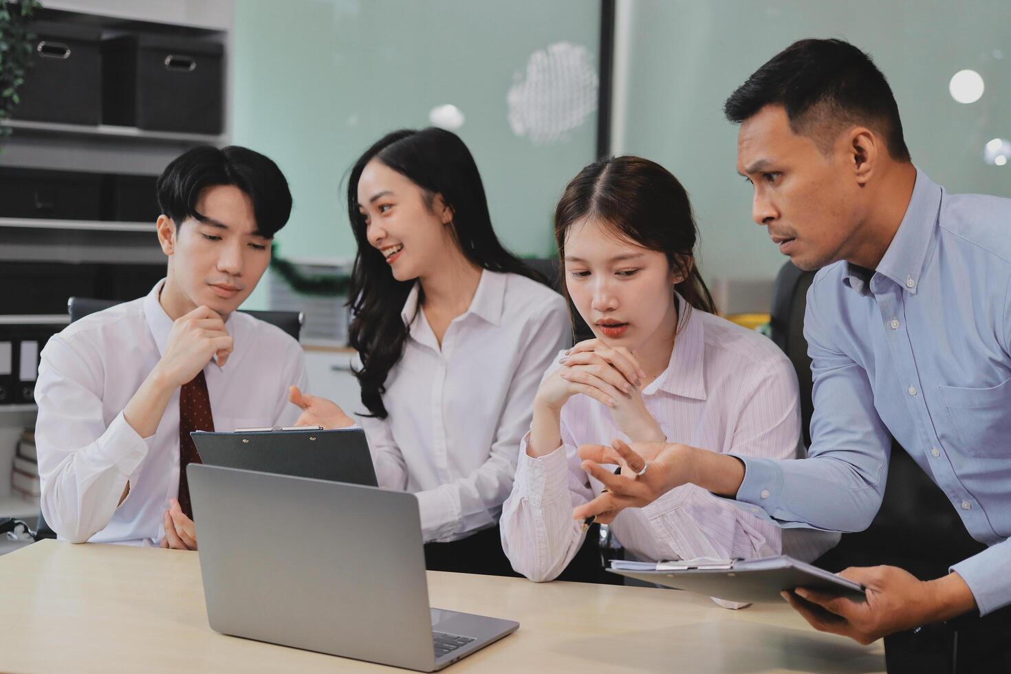 Entrepreneurs and business people conference in modern meeting room, happy multiracial coworkers have fun cooperating working together at office meeting, asian teamwork concept photo