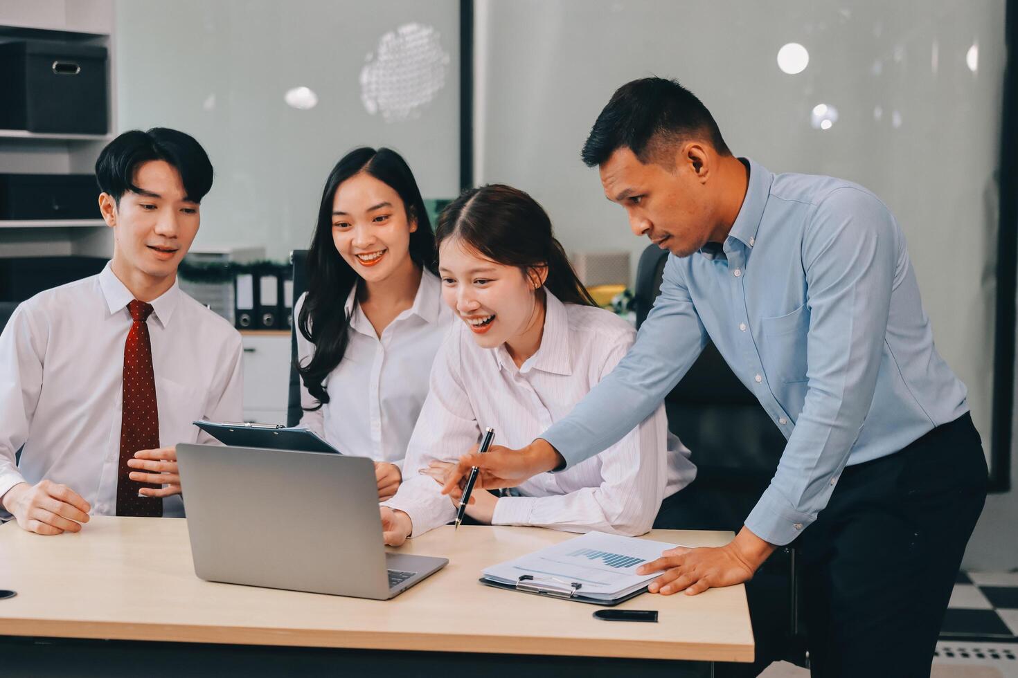 Entrepreneurs and business people conference in modern meeting room, happy multiracial coworkers have fun cooperating working together at office meeting, asian teamwork concept photo