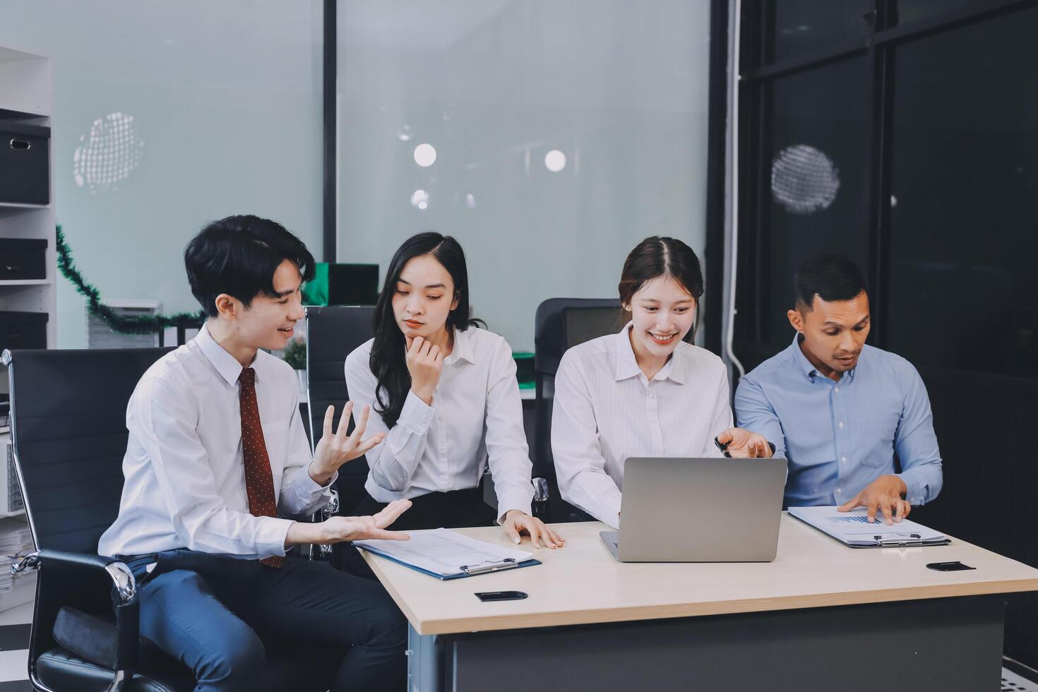 Entrepreneurs and business people conference in modern meeting room, happy multiracial coworkers have fun cooperating working together at office meeting, asian teamwork concept photo