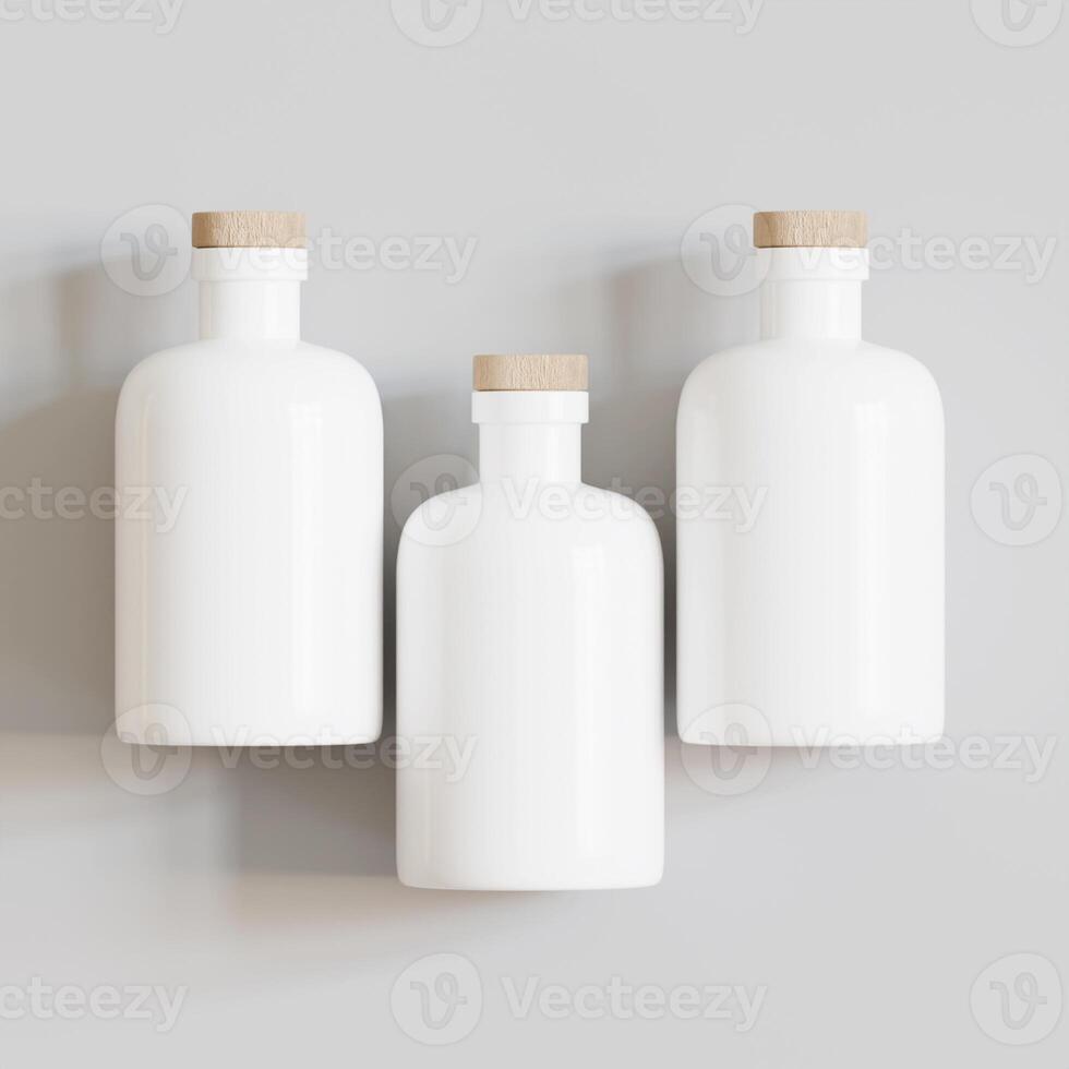 Three white bottles with wooden lids on a gray wall photo