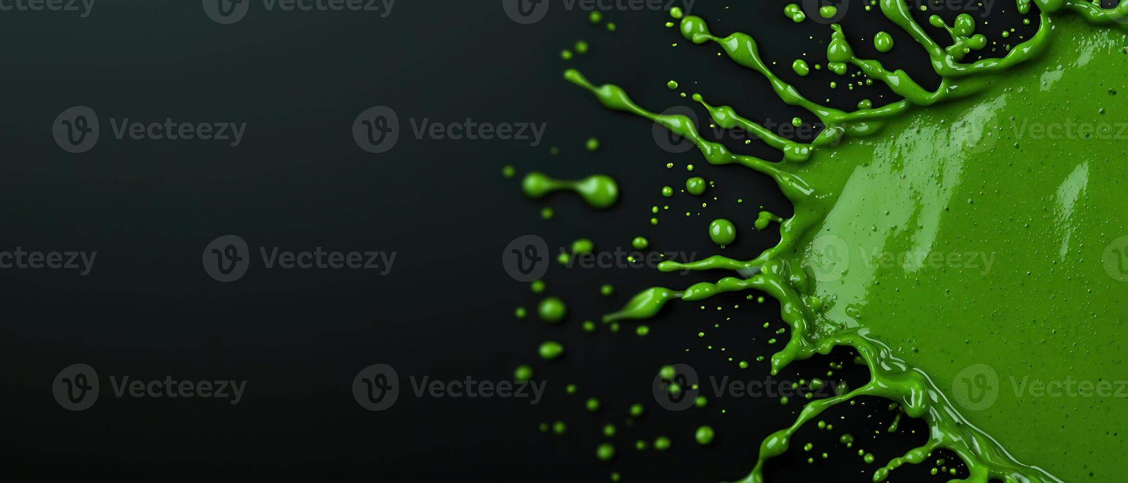 Vibrant green paint splash creating a dynamic and energetic visual effect. photo