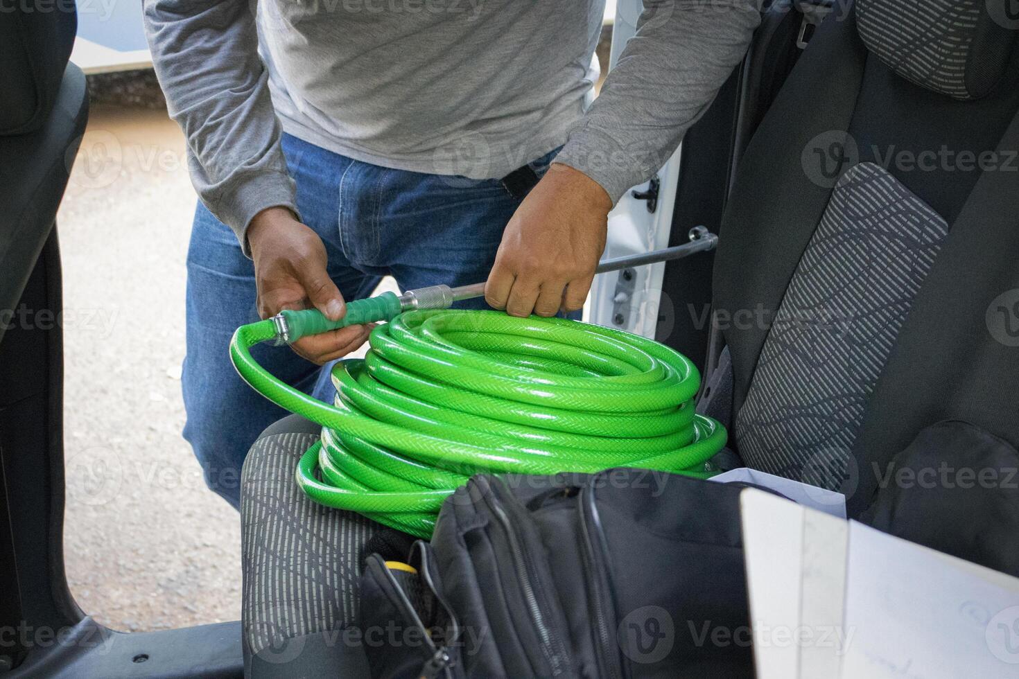 Cleaner manwith your tools. Conceptual image of car washing job. photo