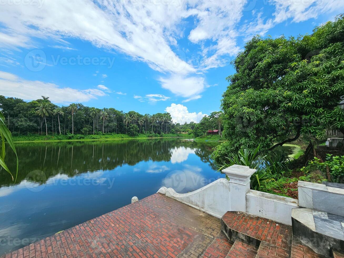 A view of a lake and a river in a park photo
