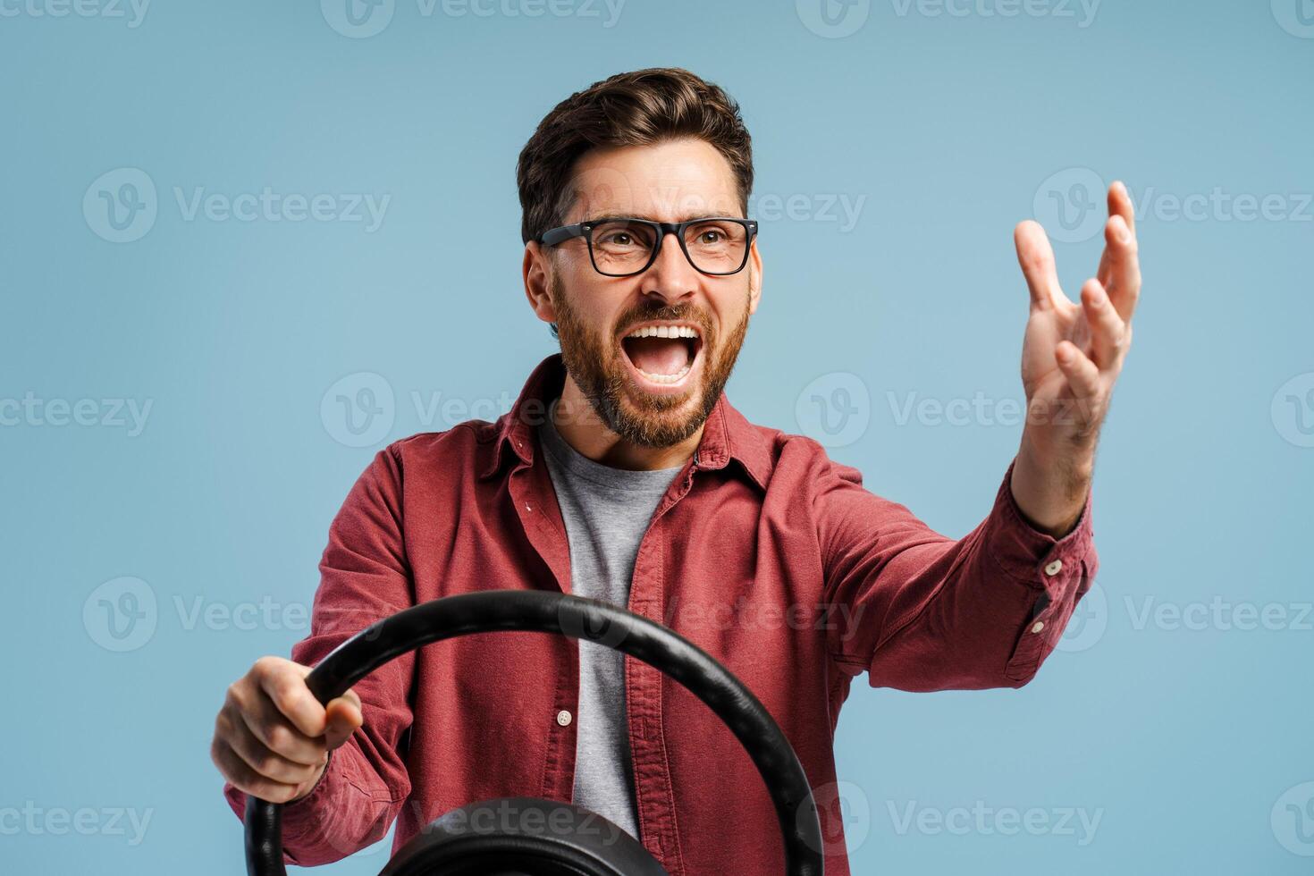 Portrait of negative, angry bearded Latin man wearing eyeglasses holding helm, shouting, gesturing photo