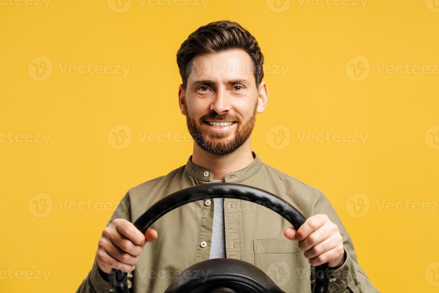 Portrait of handsome, smiling, bearded middle aged Hispanic man holding helm, looking at camera photo