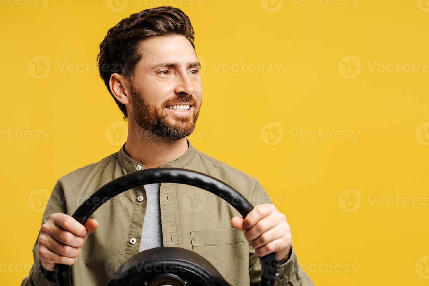 Portrait of handsome, smiling, bearded middle aged Hispanic man holding helm, looking away photo