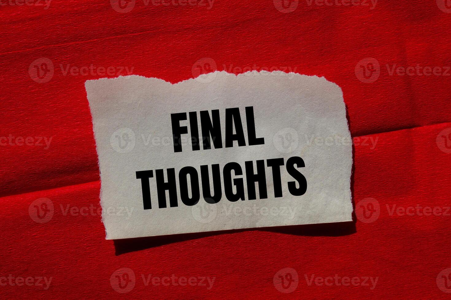 Final thoughts message written on ripped torn paper piece on red background. Conceptual final thoughts symbol. Copy space. photo