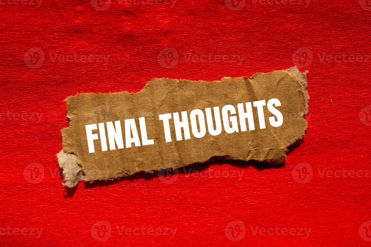 Final thoughts message written on ripped torn cardbaord paper piece with red background. Conceptual final thoughts symbol. Copy space. photo