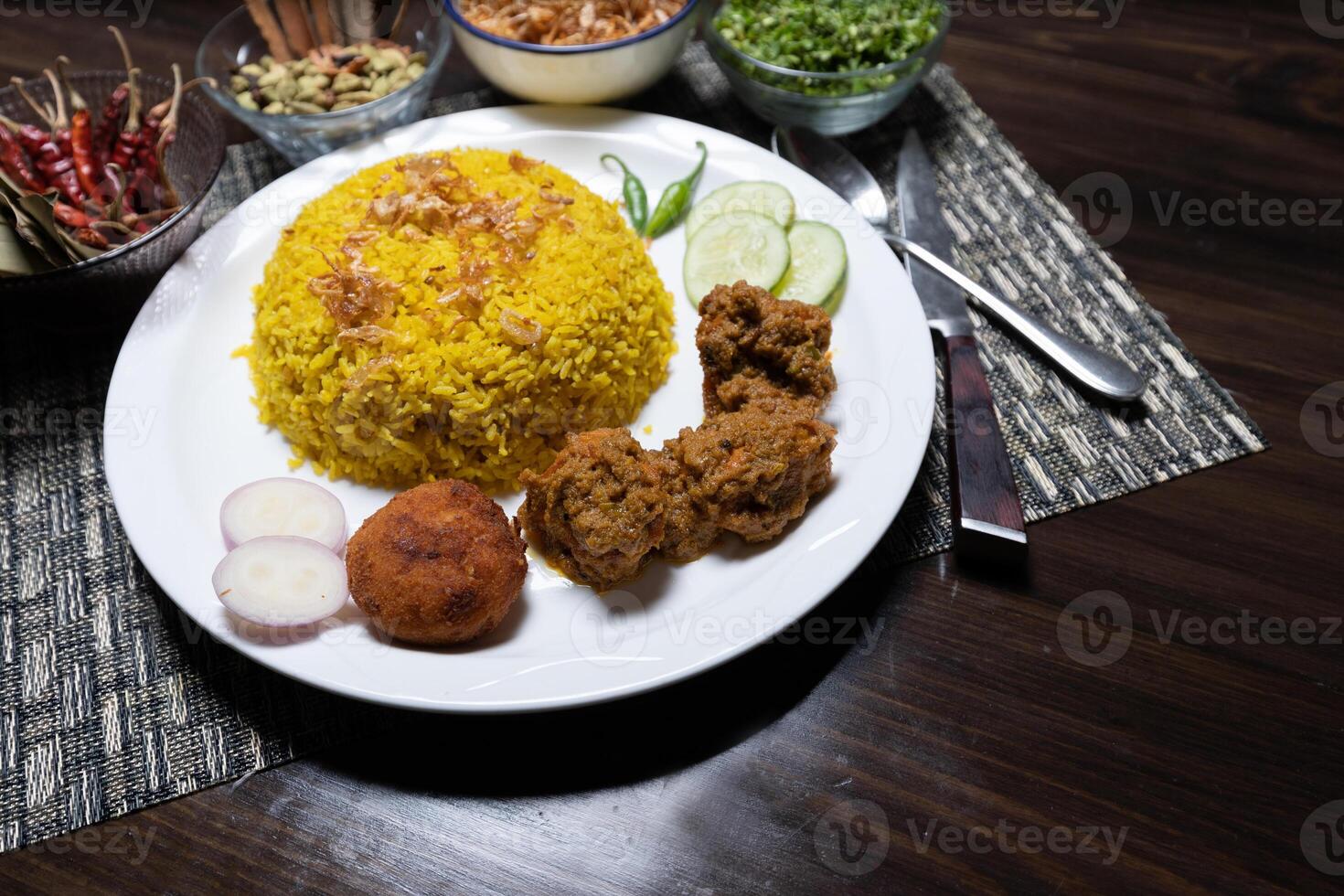 Khichdi or Khichuri with Chicken Bhuna, kebab, and salad served in a dish isolated on the background top view of Bangladesh food photo