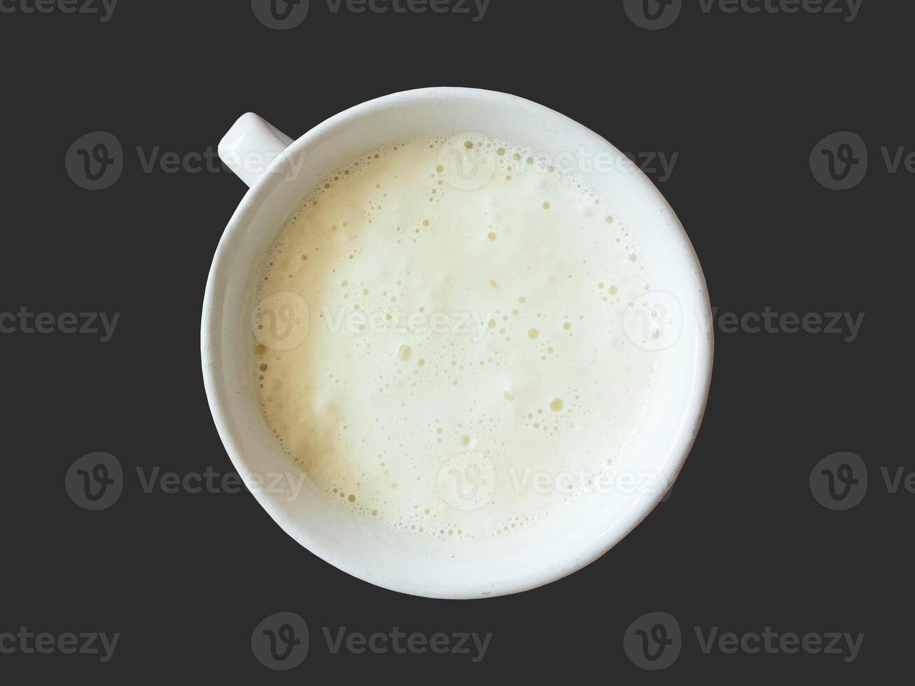Milk Foam Coffee in the Cup isolated on black background photo