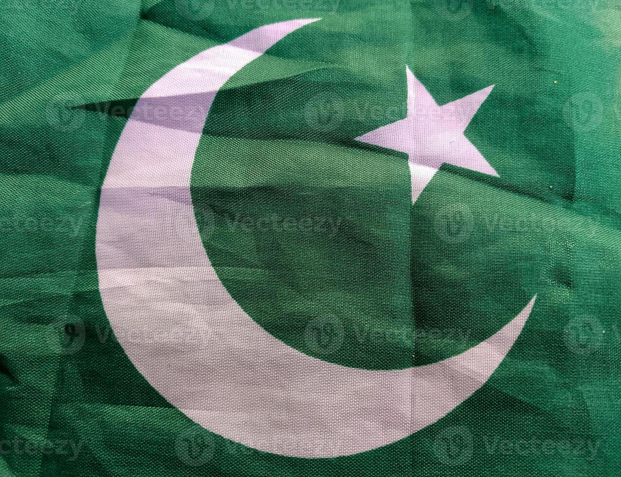 Waving cotton made Pakistani Flag with closeup view photo
