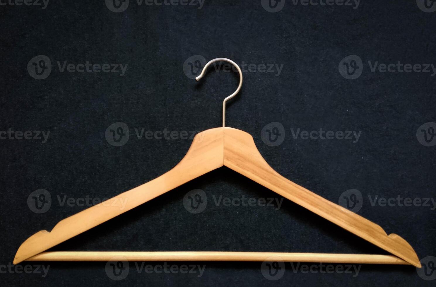 Closeup view of Cloth hanger on fabric background photo