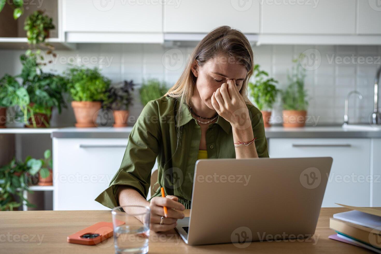 Stressed woman feeling exhausted of overtime work, realizing failure to keep to task deadline photo