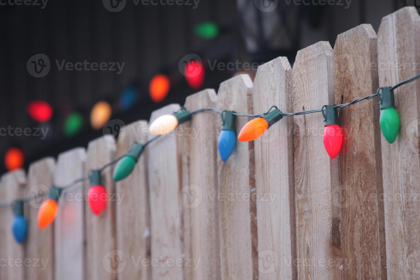 string lights on fence photo