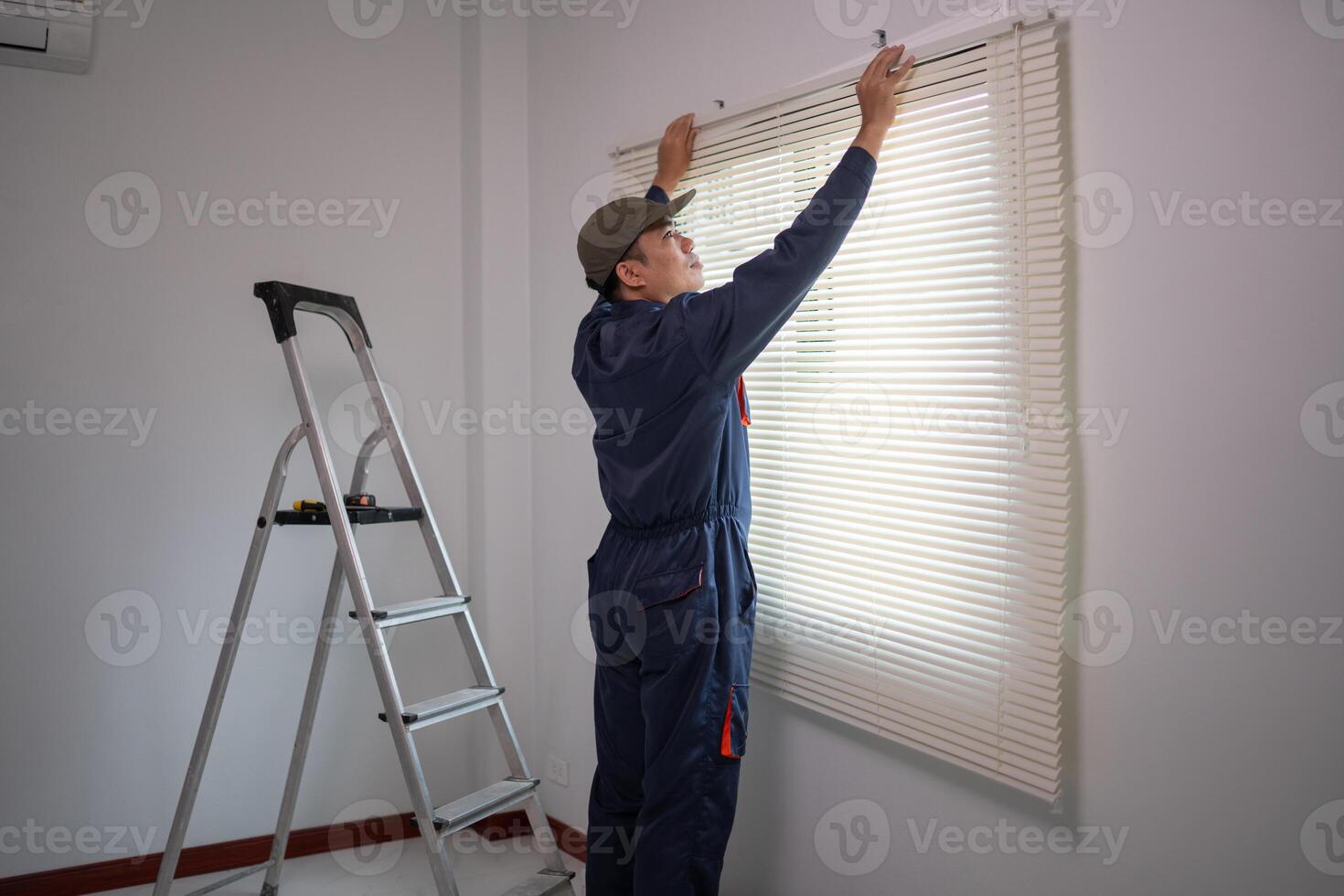 Professional Worker Installing Window Blinds in a Modern Home photo