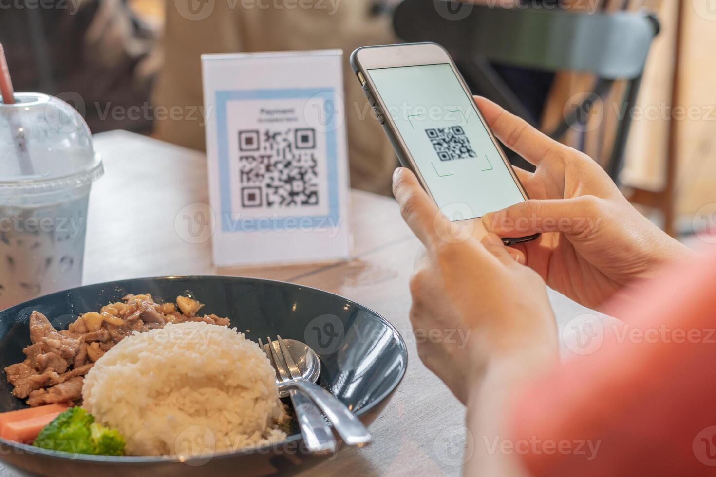 Woman use smartphone to scan QR code to pay in cafe restaurant with a digital payment without cash. Choose menu and order accumulate discount. E wallet, technology, pay online, credit card, bank app. photo