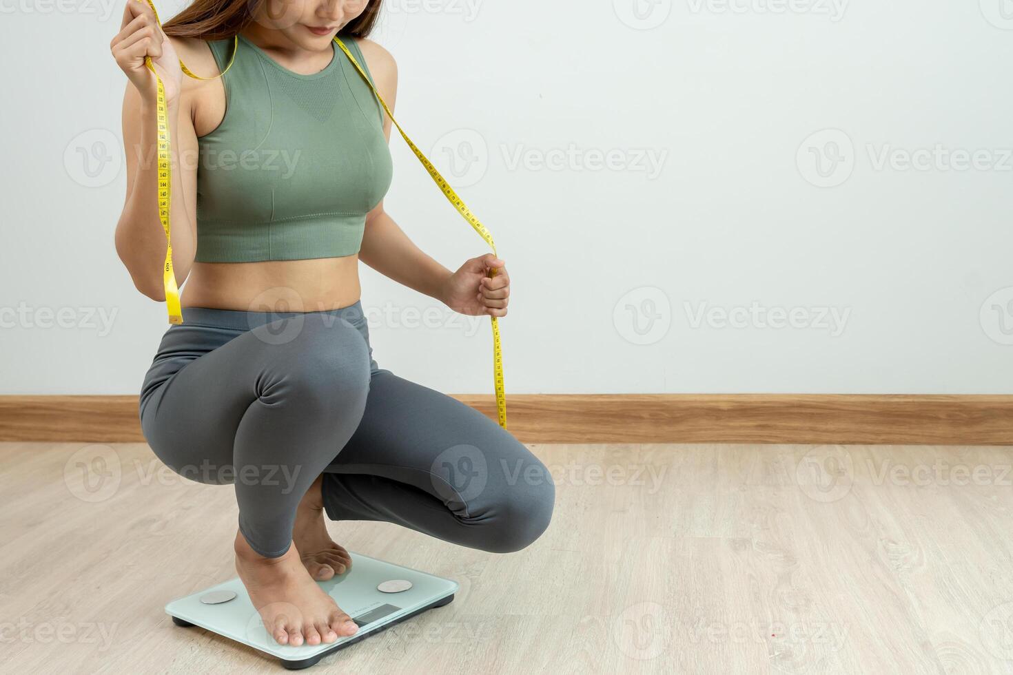 Women showing results of diet. Beautiful shape. female have a reduced waist size after under going a weight loss corse. can not wear jeans due to weight loss. balance, control, routines, exercise. photo