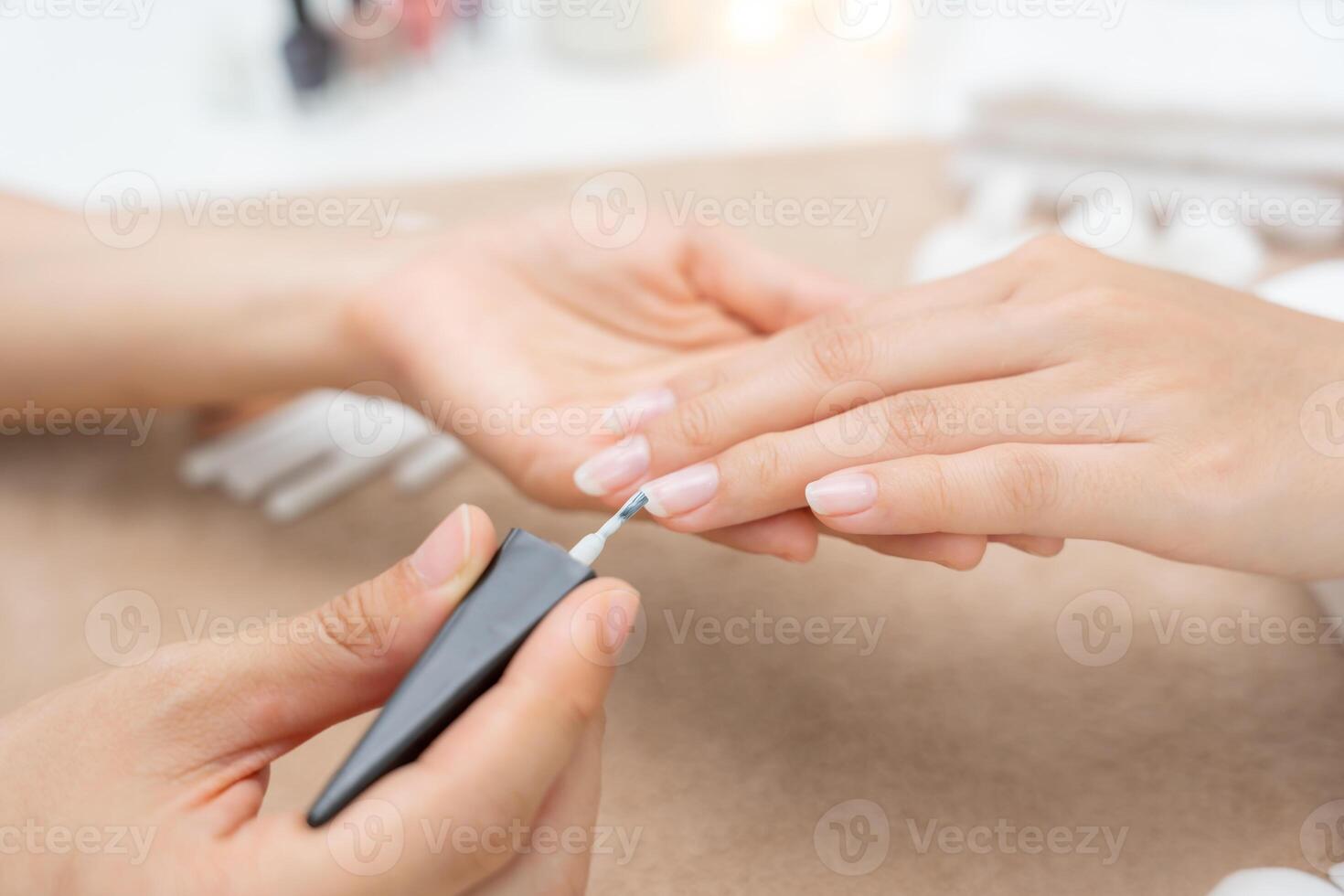 Woman receive care service by professional Beautician Manicure at spa centre. Nail beauty salon use nail file for Glazing treatment. manicurist make nail customer to beautiful. body care spa treatment photo