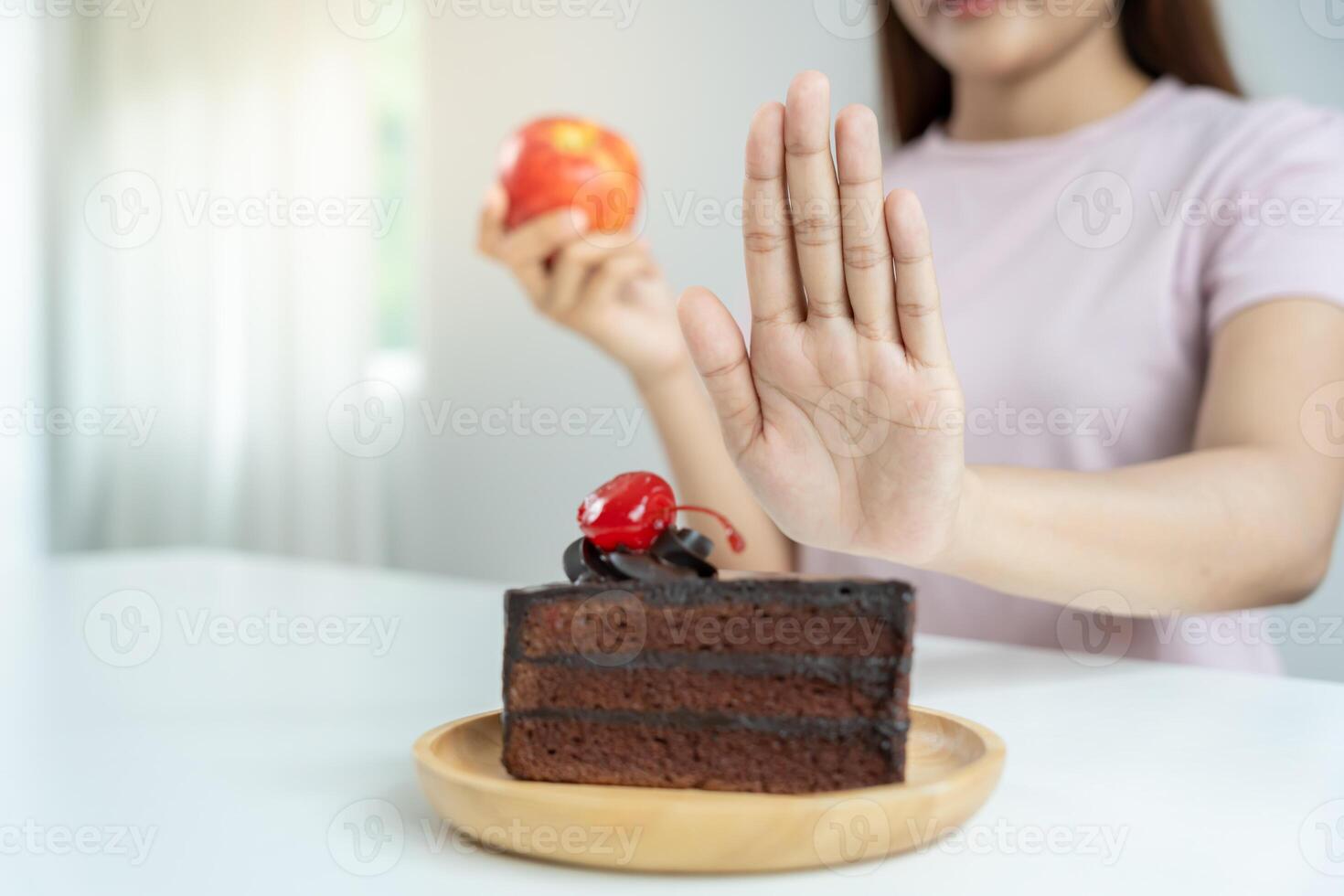 Beauty slim female body confuse chocolate cake. Woman in restaurant achieves weight loss goal for healthy life, crazy about thinness, thin waist, nutritionist. Diet, body shape. photo