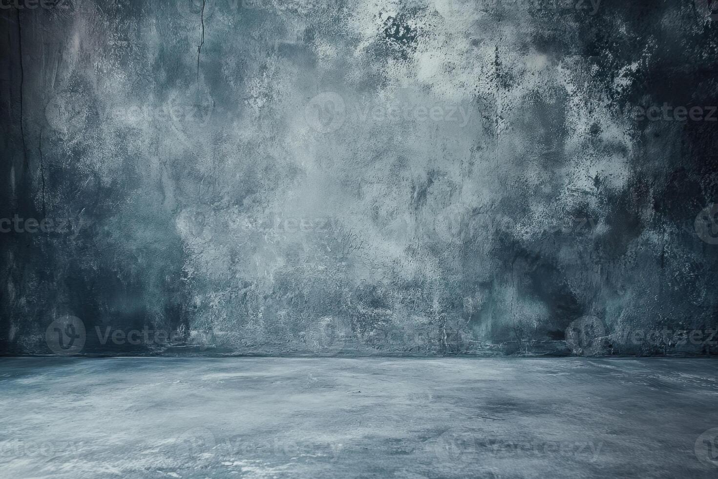 An empty room with a concrete wall and a concrete floor photo
