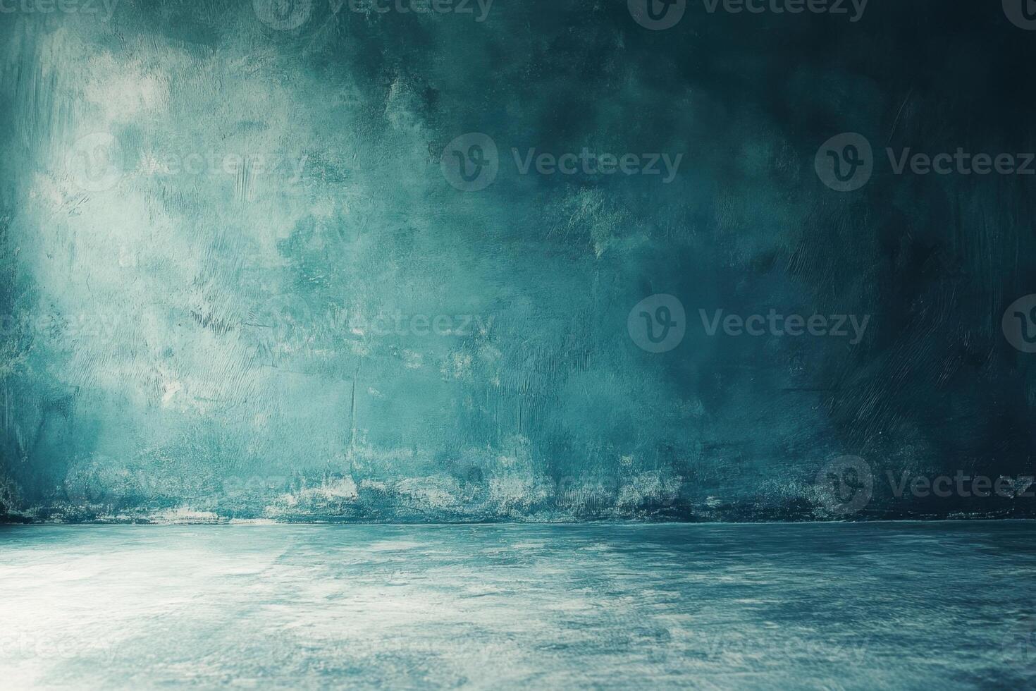 A blue concrete wall with a light source coming from the left side. photo