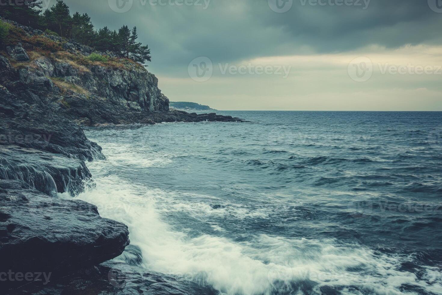 Stormy seascape with crashing waves against a rocky shoreline. photo