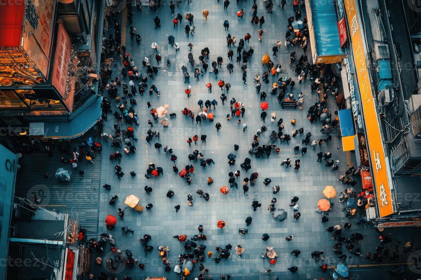 An aerial view of people walking down a street photo