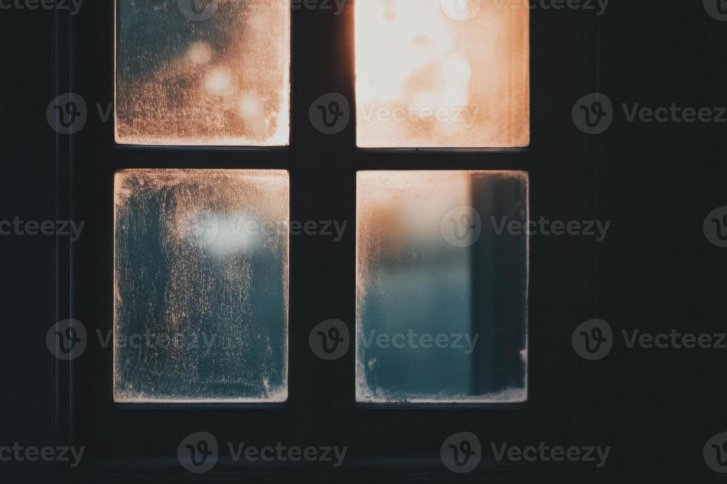 A close-up view of a windowpane with light shining through from inside. photo