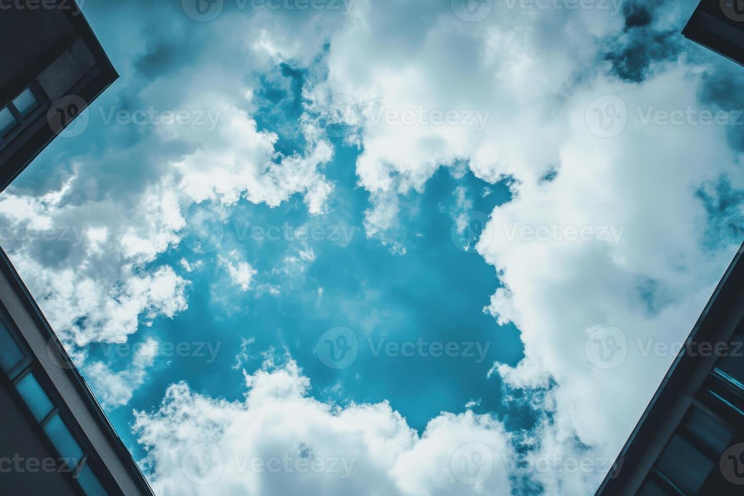 Looking up at the sky through the buildings. photo