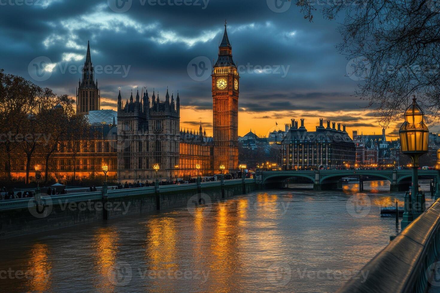 London's iconic Big Ben and Houses of Parliament at dusk, reflected in the River Thames. photo