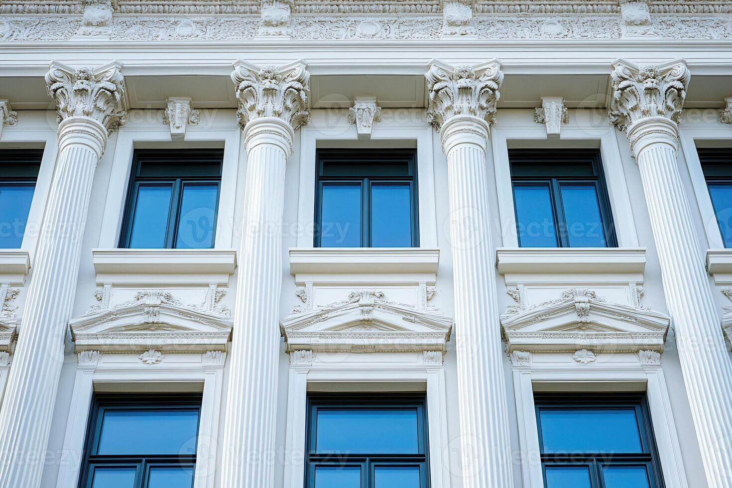 Classic white building facade with columns and windows. photo