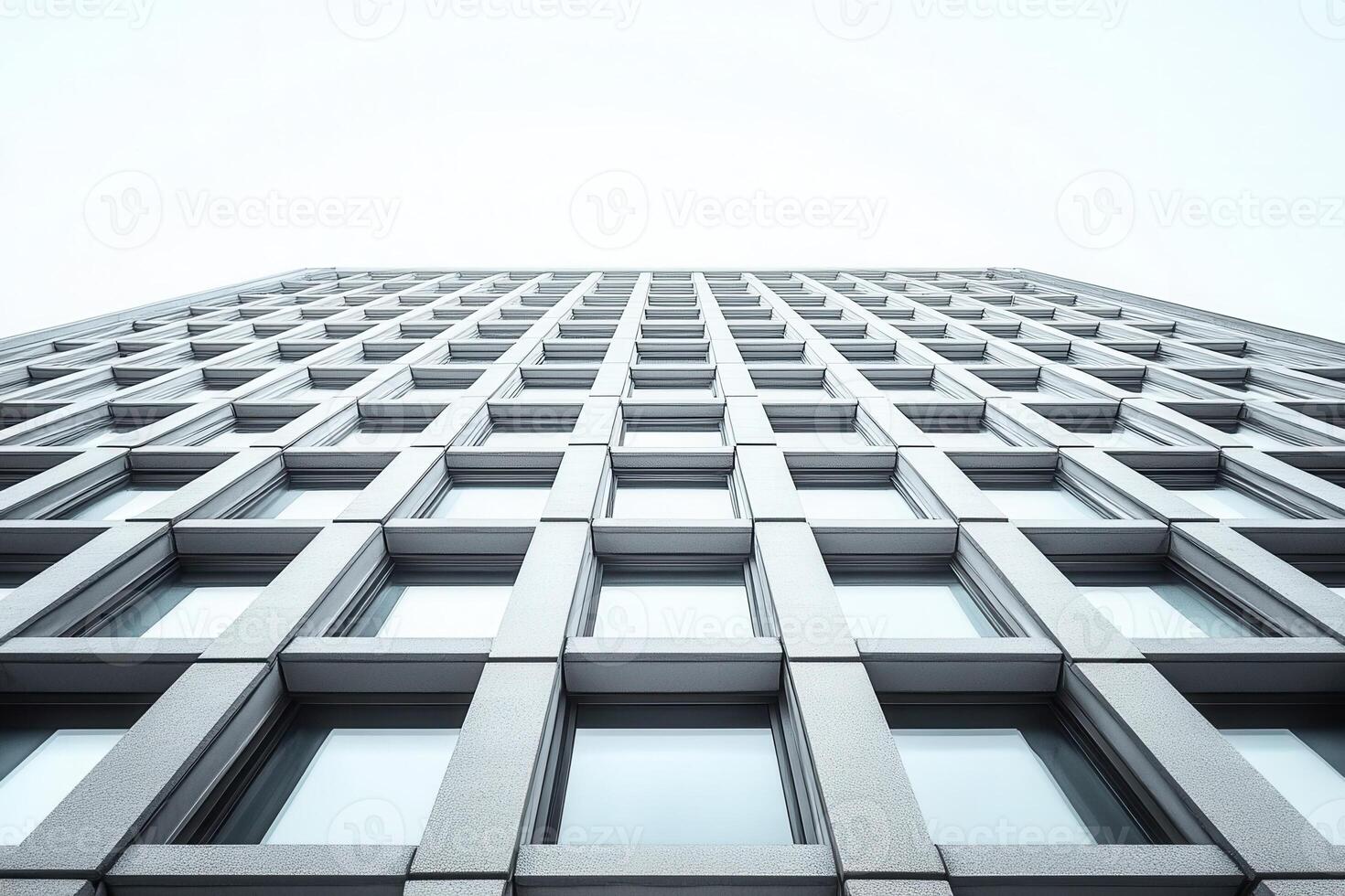 Low angle view of a modern building with repetitive windows. photo