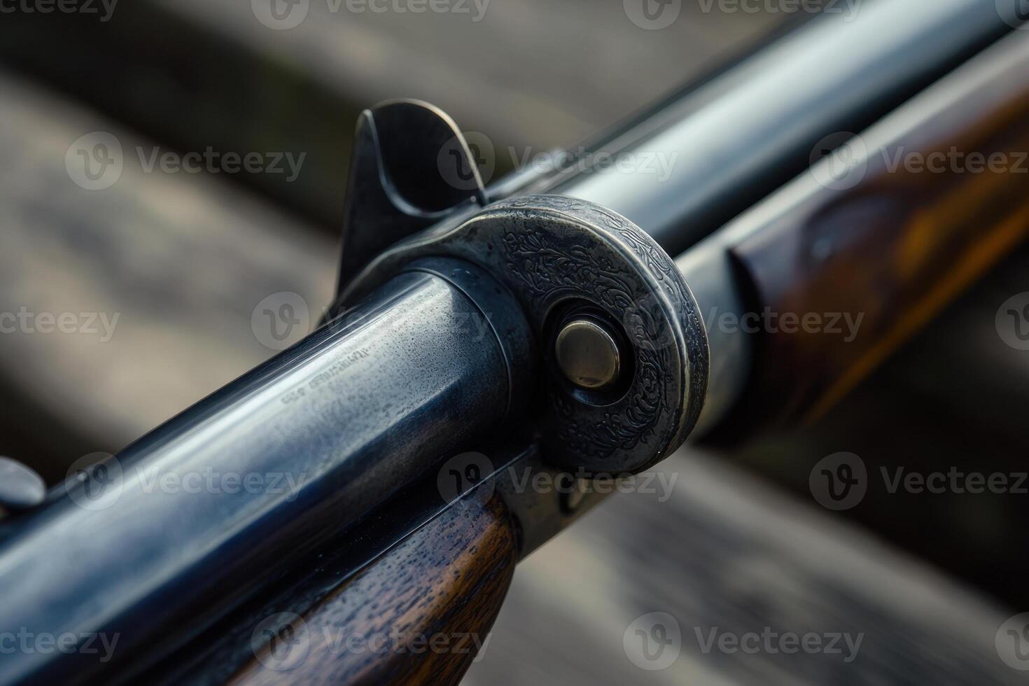 Close-up of a vintage shotgun with a wooden stock and a metal barrel. photo